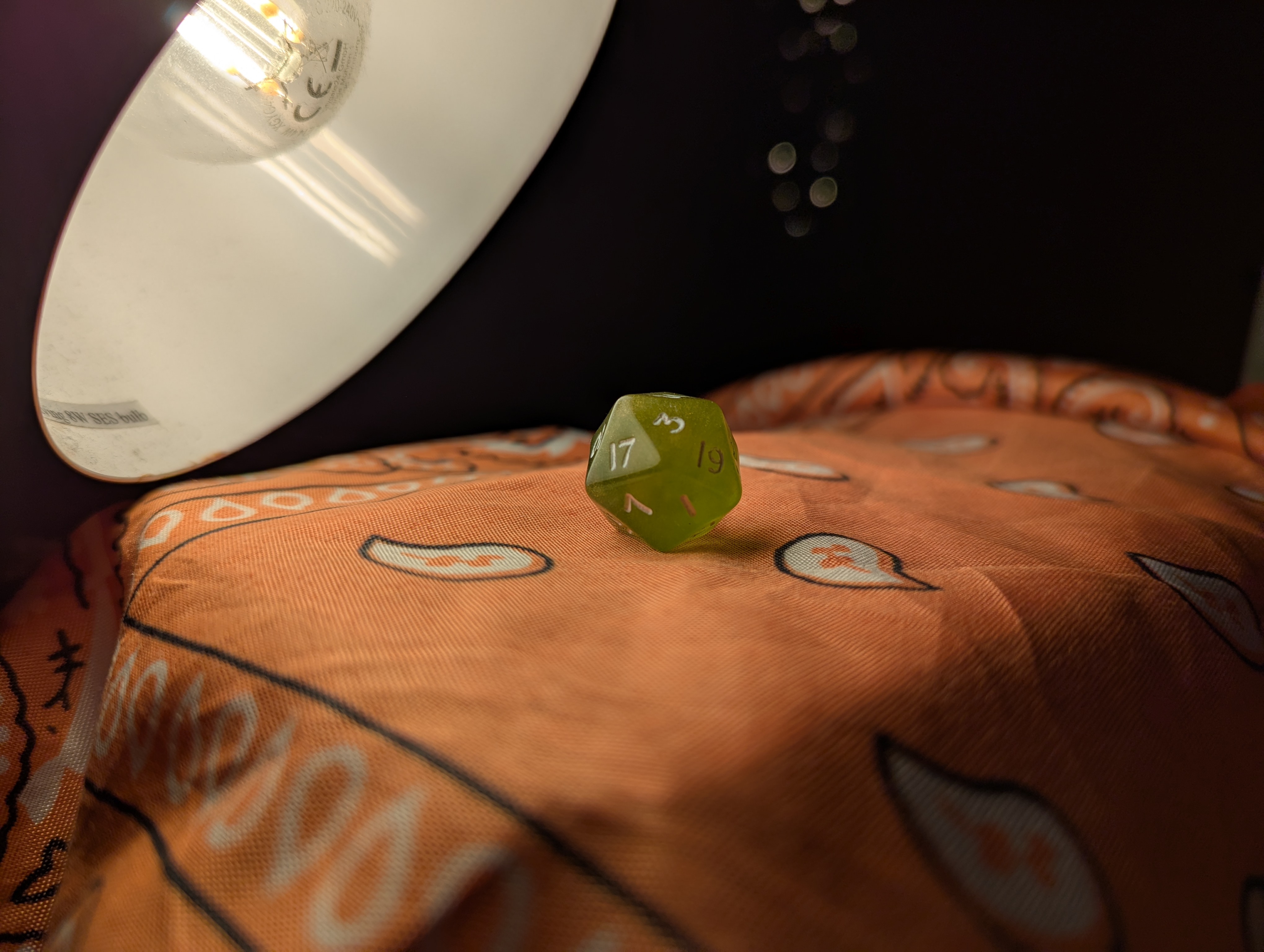 vector drawing of green dice under a lamp