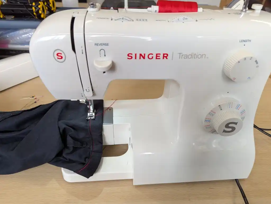 picture of sewing machine with trousers underneath