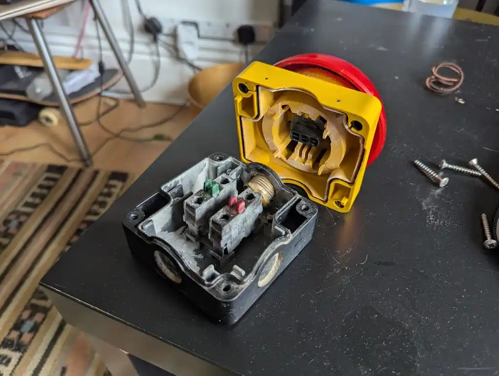 picture of large red button, taken apart