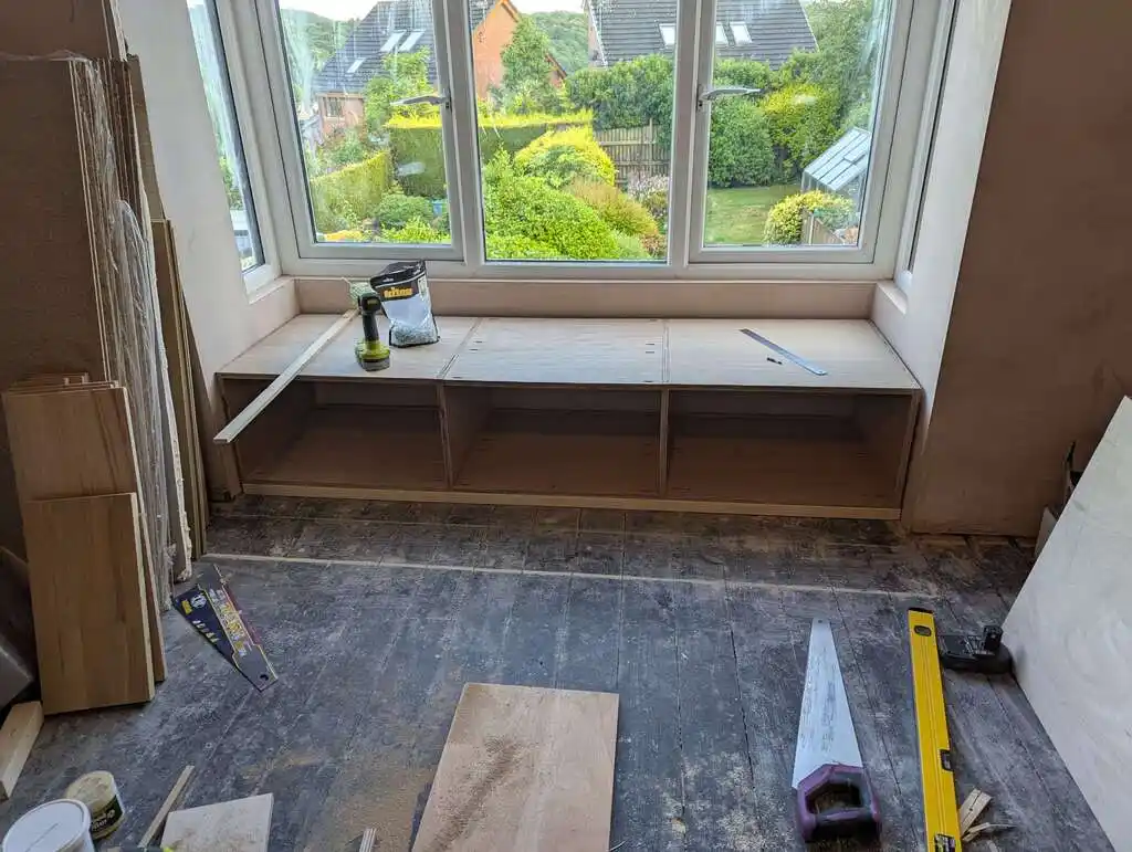 picture of window bay, with assembled cupboards