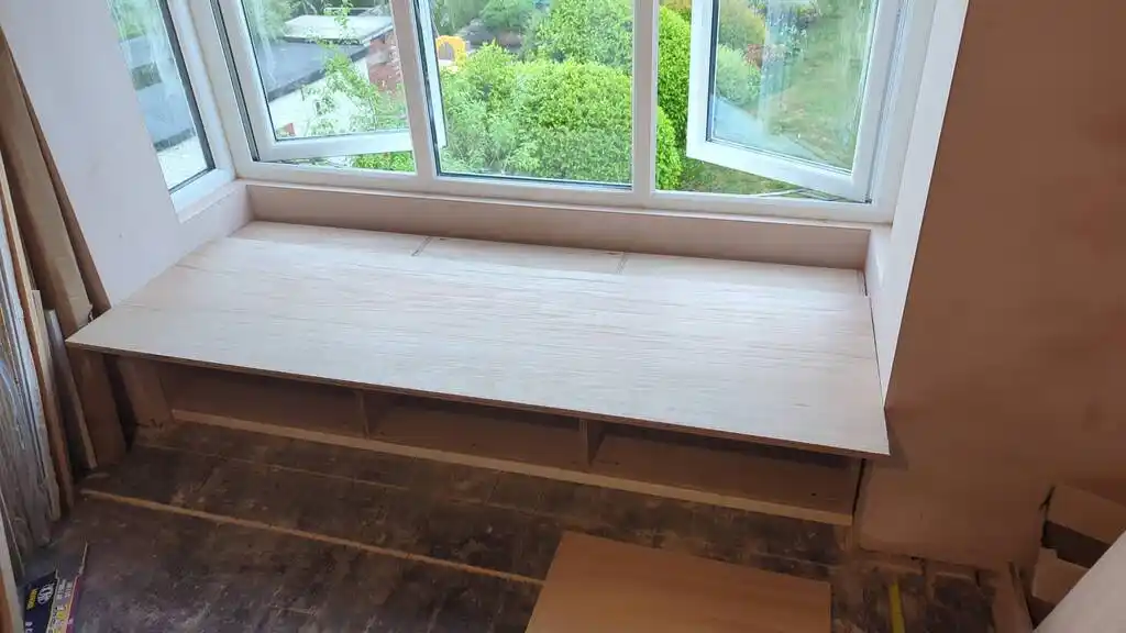 picture of window bay, with assembled cupboards
