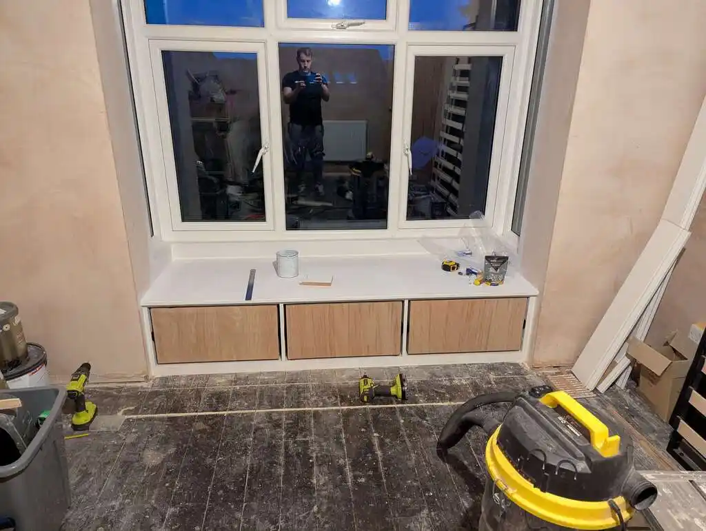 picture of window bay, with assembled cupboards
