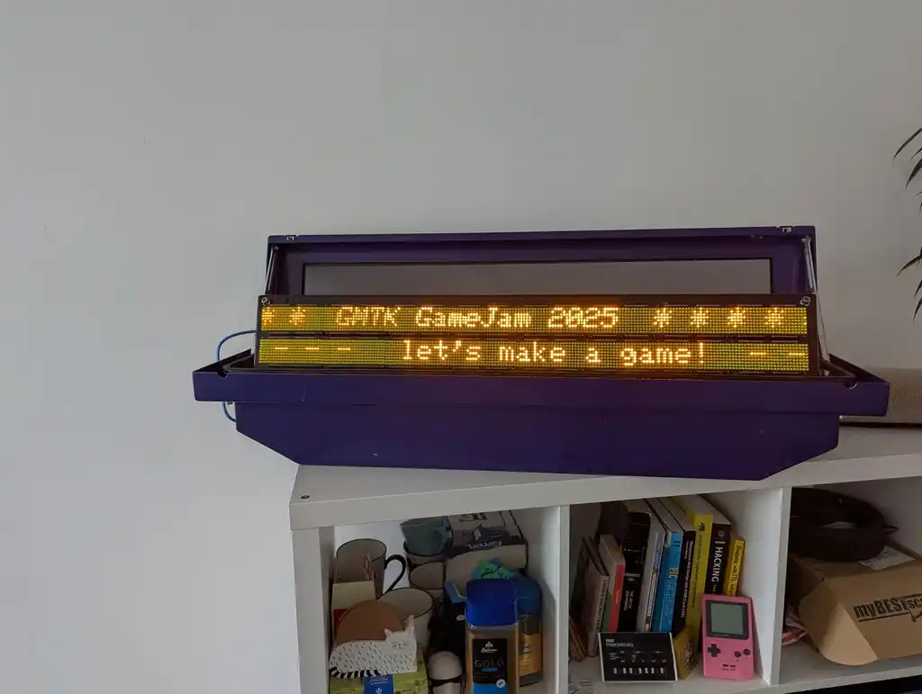 picture of transport sign displaying "GMTK GameJam 2025 – let's make a game!"