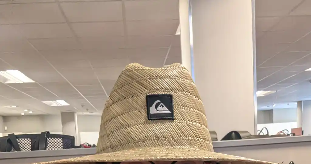 picture of the top of a straw hat, with a logo on it