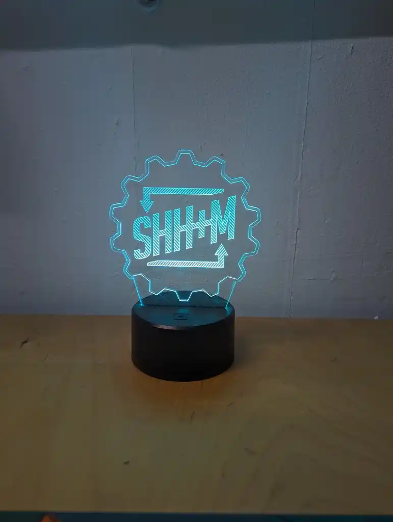 picture of Sheffield Hackspace logo in a lightbox, lit