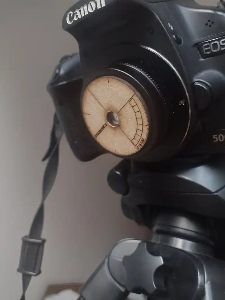 picture of a camera with a laser-cut pinhole disc on the front