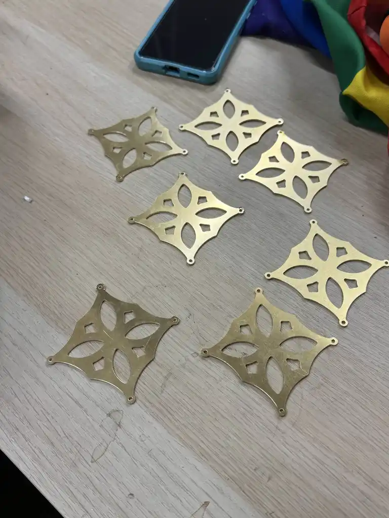 picture of many cut metal geometric shapes