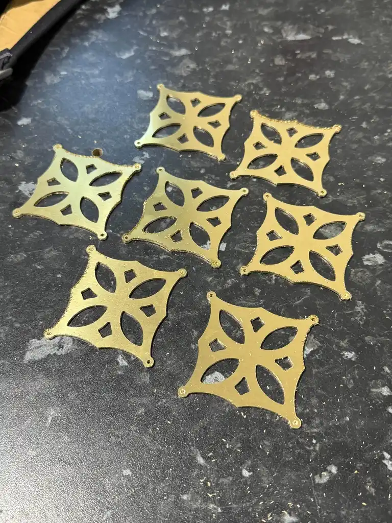 picture of many cut metal geometric shapes