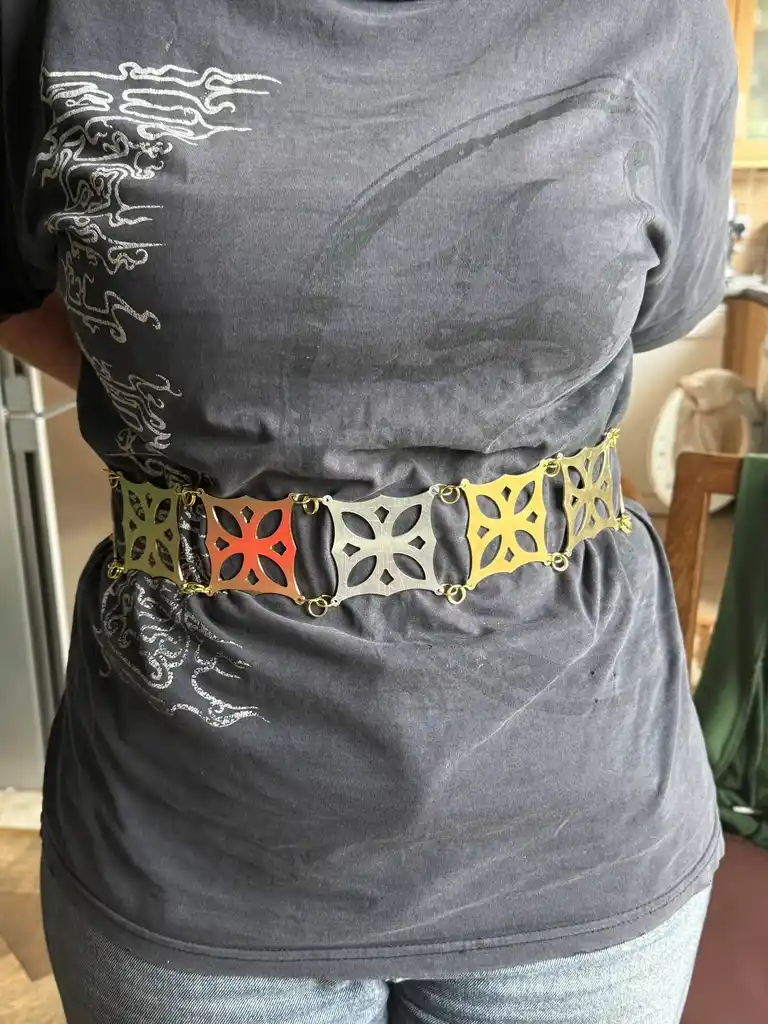 picture of belt made from cut metal geometric shapes