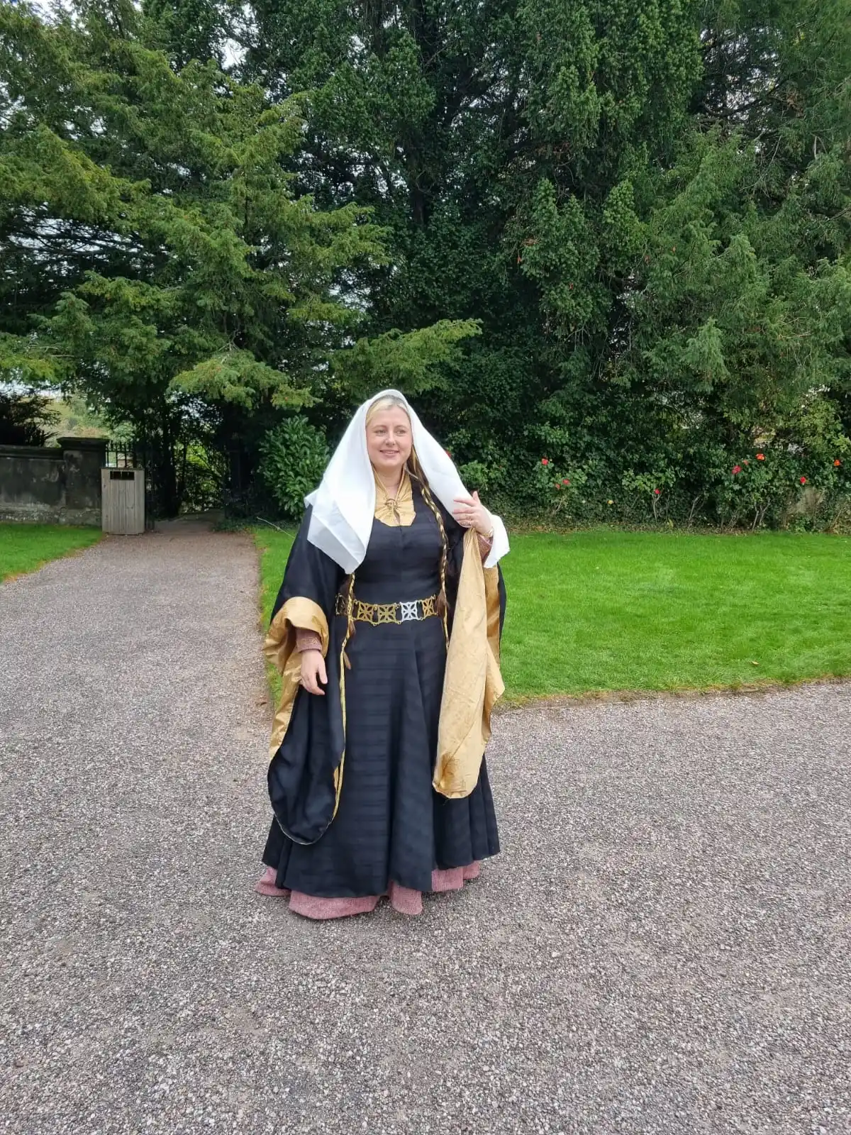 picture of person wearing belt made from cut metal geometric shapes