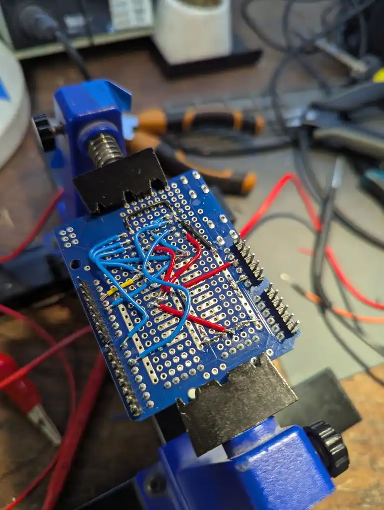 picture of prototype Arduino shield bottom with many soldered wires attached