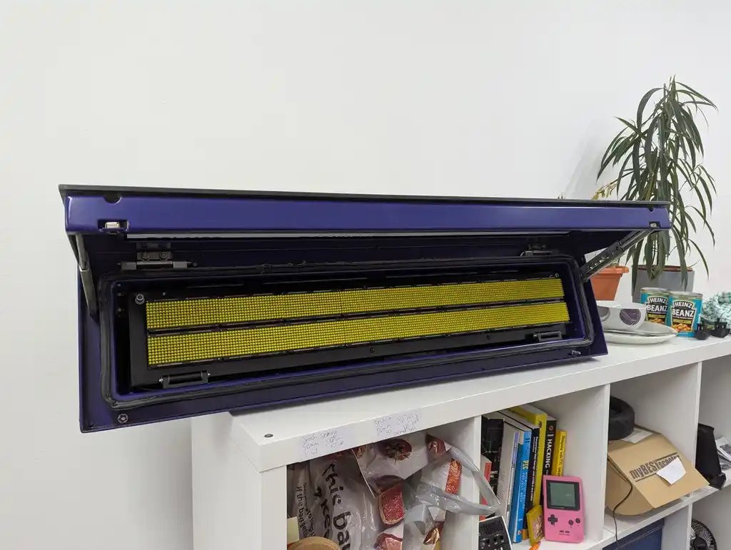 picture of bus sign with hatch open, showing interior LED matrix