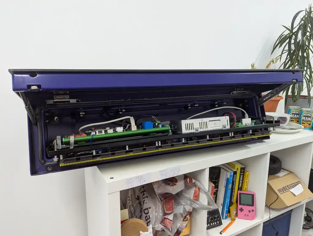 picture of bus sign with hatch open and LED panel open, showing interior electronics