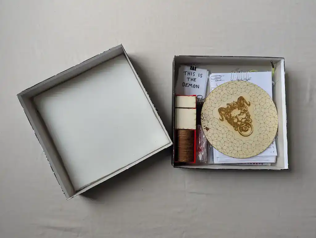 picture of a board game, with several different contents inside a box