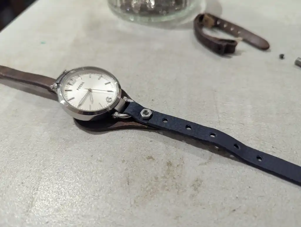 picture of a watch, with relpacement strap attached