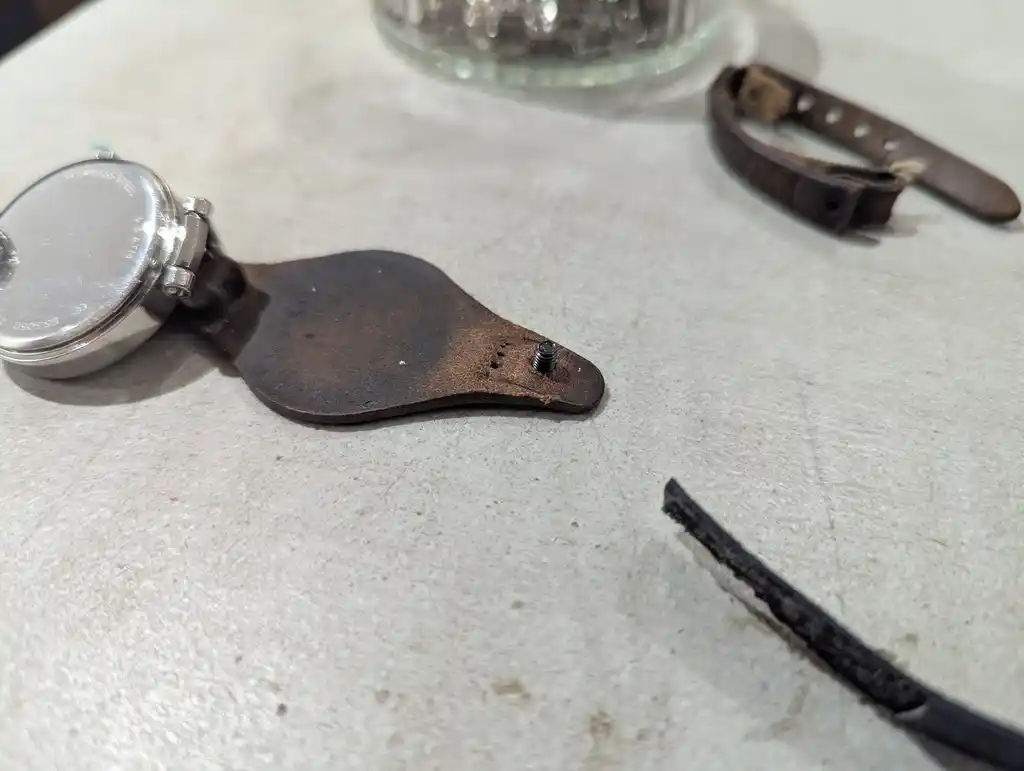 picture of a watch, with strap disassembled