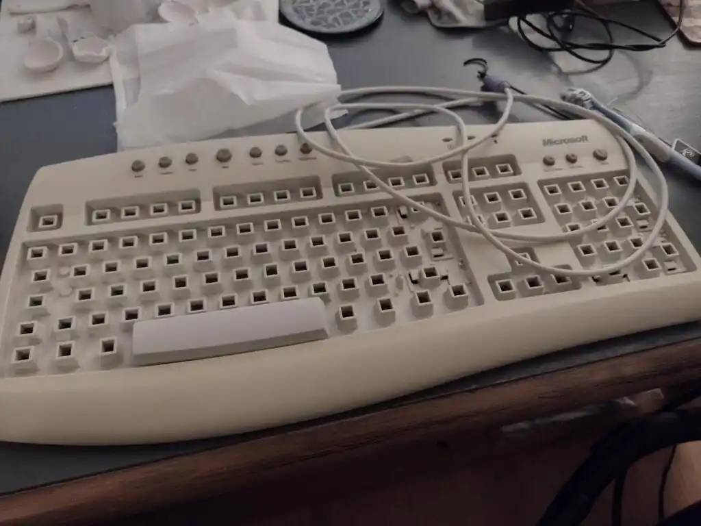 picture of old computer keyboard without keys, clean