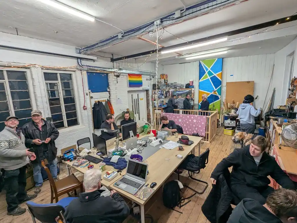 picture of Sheffield Hackspace's common room, filled with lots of people