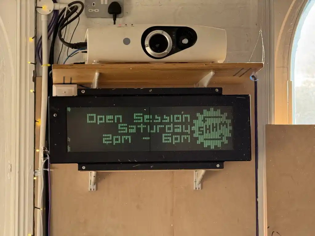 picture of large LCD train sign mounted to shelf