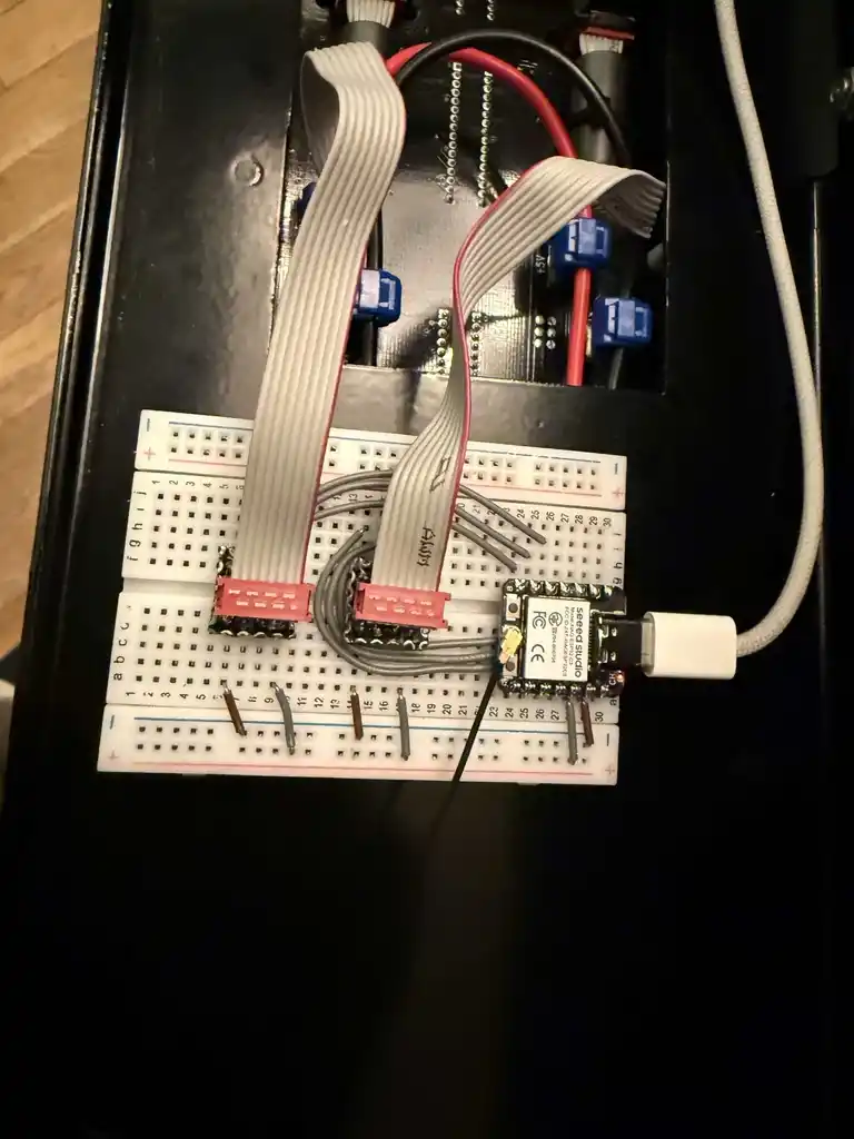 picture of breadboard with ribbon cable connectors and small microcontroller