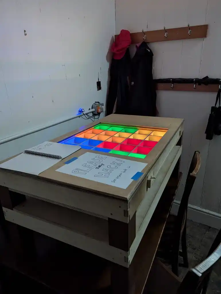 picture of drawer full of grid of LEDs, which are lit up colours