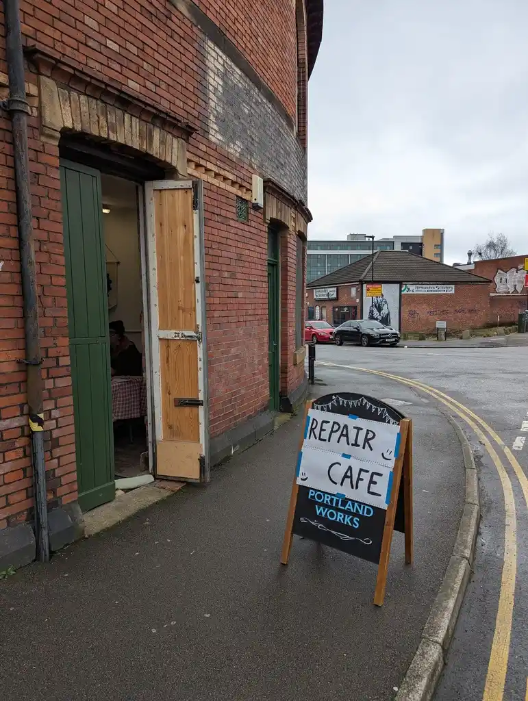 picture of Sheffield Hackspace, with a repair café sign in front