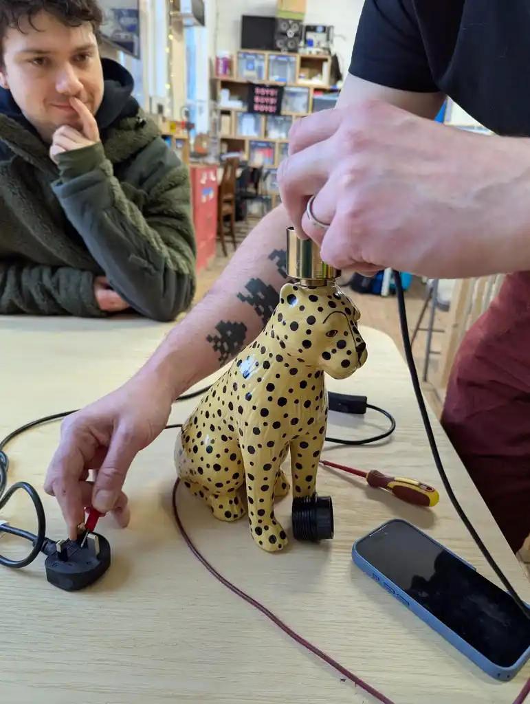 picture of a leopard lamp being taken apart