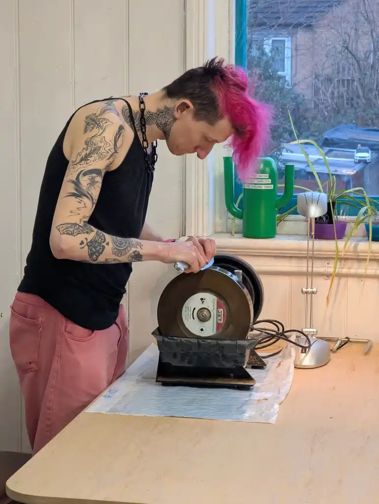 picture of a person sharpening knives