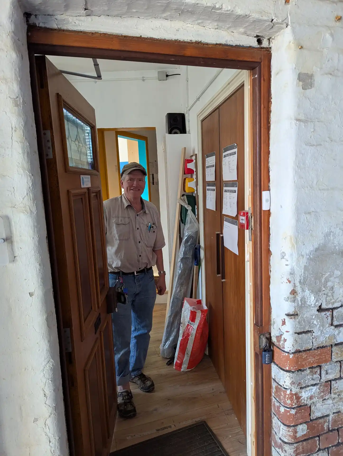 picture of someone inside Sheffield Hackspace opening the front door for the viewer