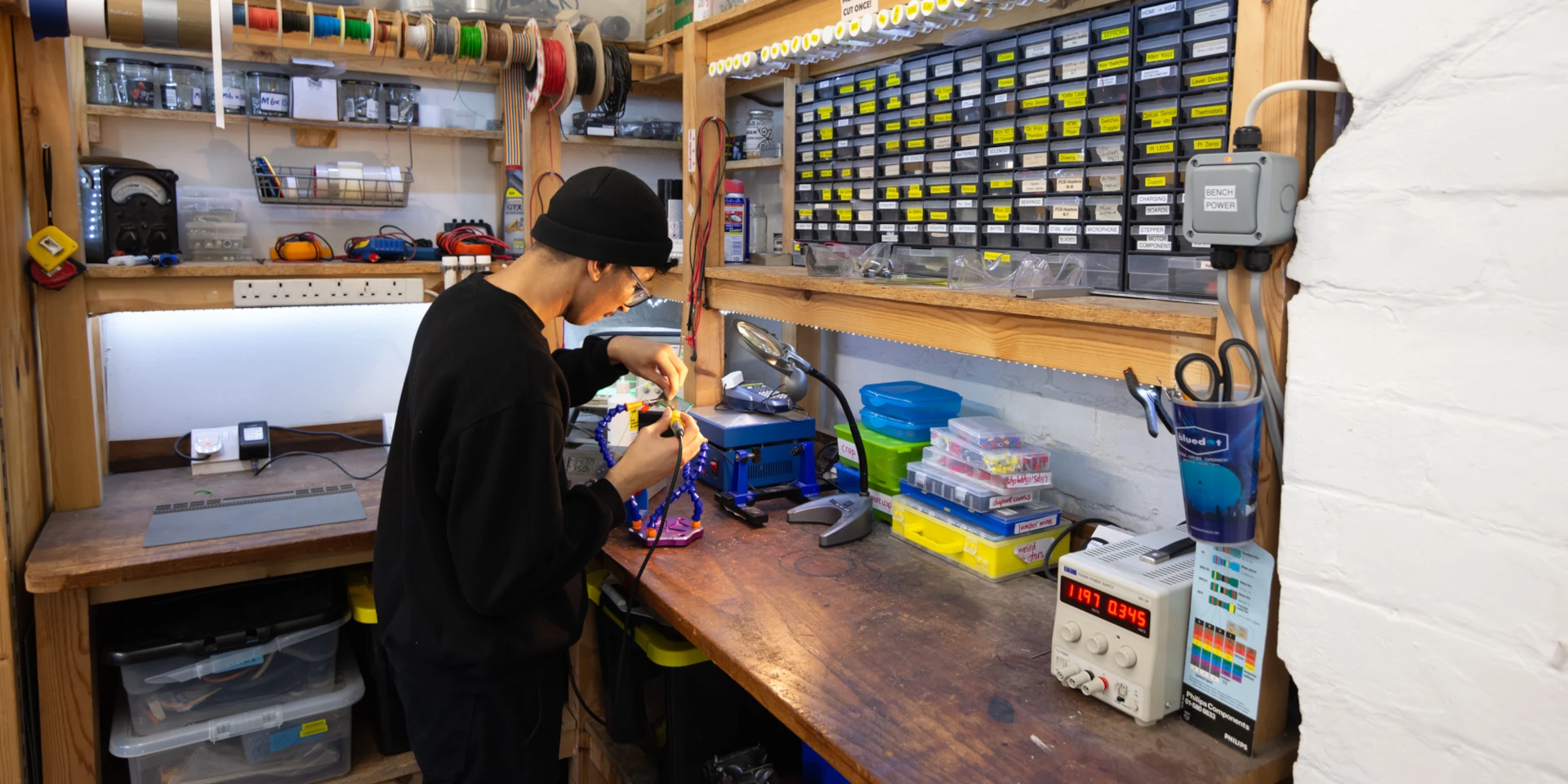 picture of a person using a soldering iron